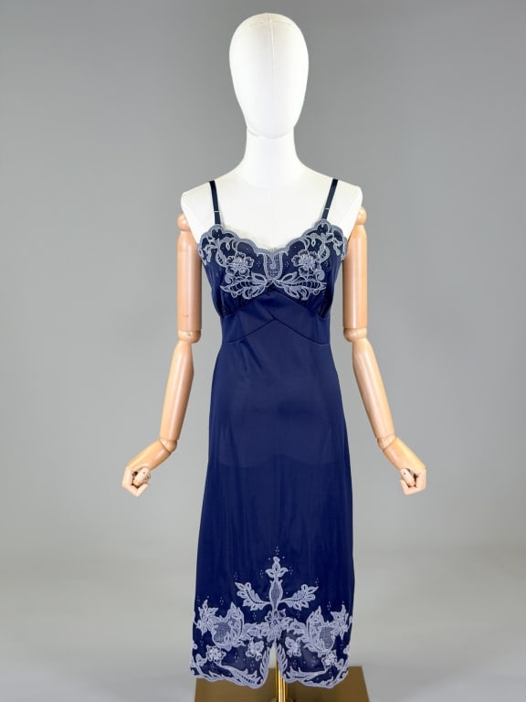 Vintage 1950s Nylon Knit Embroidered Slip Dress: Vintage 1950s Nylon Knit Embroidered Slip Dress having floral embroidery throughout with stretch. Marked size 34. Measuring 34-38 inch bust, 27-32 inch waist, 43 inches long.