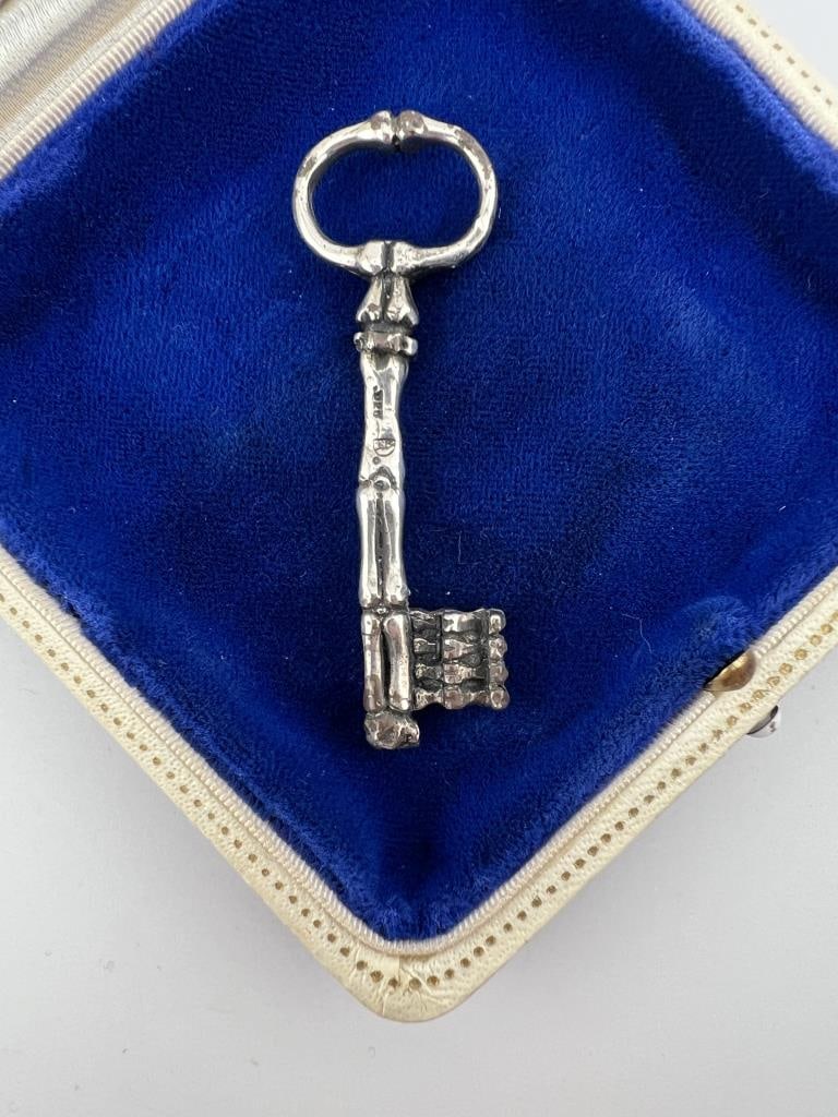 Sterling Figural Bone Motif Skeleton Key Pendant: Sterling Silver Figural Bone Motif Skeleton Key Pendant. Hallmarked. Measures approximately 2.5 inches in length.