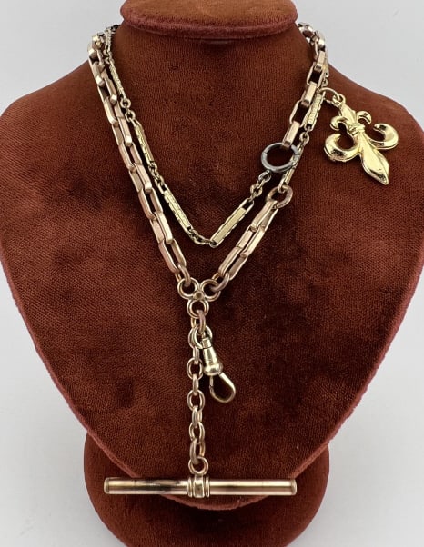 Antique Gold Filled Watch Chain Necklace w Fob: Antique Gold Filled Watch Chain Necklace w Fob. Antique watch chain necklace with fleur de lis charm, dog clip, T bar, gold filled chain / elements. Measures 20 inches in length, drop with dog clip an