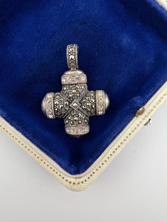 Sterling Silver & Marcasite Maltese Cross Pendant: Sterling Silver & Marcasite Maltese Cross Pendant. Sterling silver necklace pendant set with rose cut marcasite stones. Hallmarked on the back. Measures 1.75 inches in length.