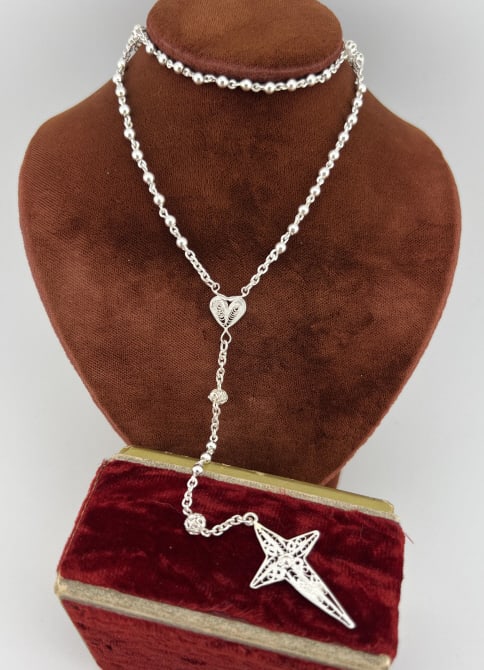 Vintage Sterling Filigree Rosary Bead Necklace: Vintage Sterling Filigree Rosary Bead Necklace. Handmade sterling silver rosary bead set, hallmarked on the back. Measures 16 inches in length, plus 4 inch drop from the central heart plaque to the bo