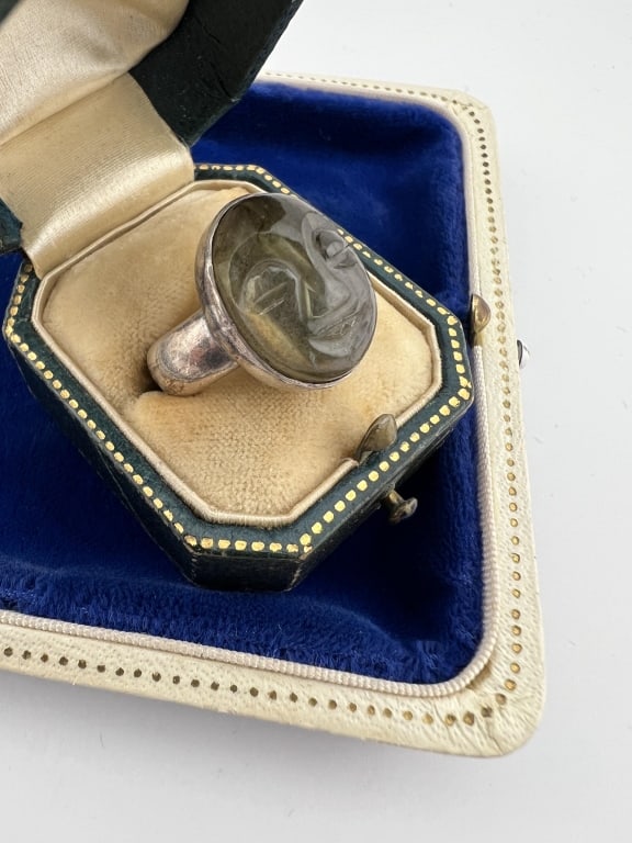 Sterling Silver Labradorite Man in the Moon Ring: Sterling Silver Labradorite Man in the Moon Ring. Hallmarked. Hand carved man in the moon face with nice color change / color flash iridescence through the face. Ring size 5. Face in bezel measures ne