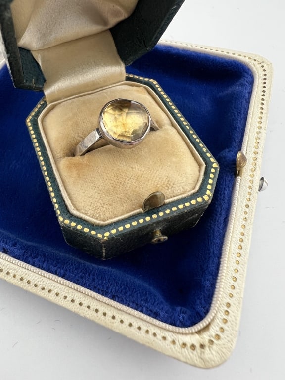 Sterling Silver & Rose Cut Citrine Solitaire Ring: Sterling Silver & Rose Cut Citrine Solitaire Ring. Stamped STER inside the band. Citrine is bezel set. Ring size 5.75
