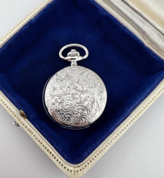 Vintage Arnex Incabloc 17 Jewel Pocket Watch: Vintage Arnex Incabloc 17 Jewel Pocket Watch Pendant. White face with Roman Numerals. Measures 2 inches in length. Scrollwork design on front and back of the case.