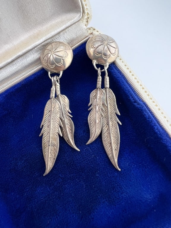 Vintage Native American Sterling Concho Earrings: Pair of Vintage Native American Sterling Silver Concho & Feather Pendant Earrings. Each measures just over 2.25 inches in length.