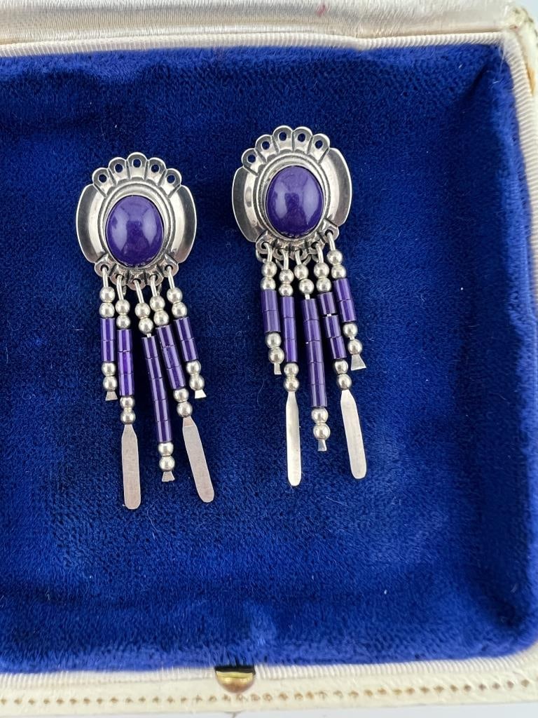 Vintage Native American Sterling & Lapis Earrings: Pair of Vintage Native American Sterling & Lapis Earrings. Set with lapis lazuli cabochons and beads. Signed and hallmarked on the backs. Each measures 2 inches in length.