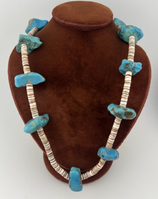 Vintage Native American Turquoise Bead Necklace: Vintage Native American Turquoise Bead Necklace. Made with large turquoise beads and carved round shell beads. Measures 21 inches in length approximately.