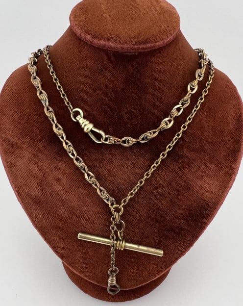 Antique Gold Filled Necklace w Dog Clip & T Bar: Antique Gold Filled Necklace w Dog Clip & T Bar. Having a dog clip clasp, ornate knot motif and rolo link chains, drop with T bar and dog clip for pendant / charms. Chains measures 26 inches in length
