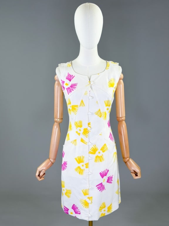 Vintage 1980s Courreges Printed Rayon Shift Dress: Vintage 1980s Courreges Printed Rayon Shift Dress having button front closure and two front pockets with print throughout. Marked size 36. Measuring 34 inch bust, 26-28 inch waist, 35 inches long.