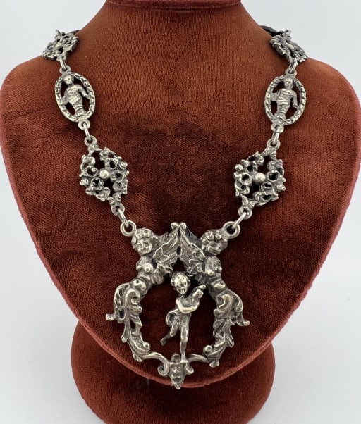 Antique Peruzzi Style Italian Mythology Necklace: Antique Peruzzi Style Italian Mythological Motif Necklace. Stamped ITALY on the back. Designs of cherubs, caryatids, rosettes etc. Measures approximately 17 inches in length.