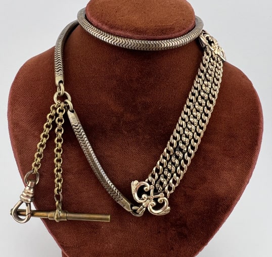 Antique Watch Chain Necklace w T Bar & Dog Clip: Antique Watch Chain Necklace w T Bar & Dog Clip. Having a finely articulated chain, triple strand curb link ribbon, rolo link chain drops with T bar and dog clip at the ends. Spring ring clasp. Measur