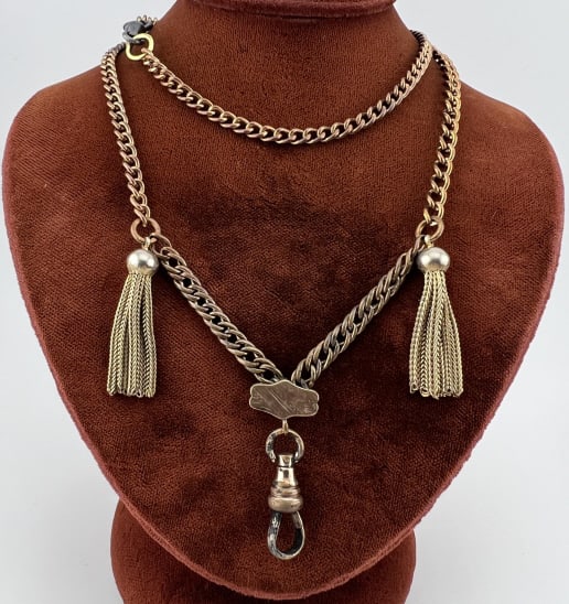 Antique Watch Chain Necklace w Tassels & Dog Clip: Antique Watch Chain Necklace w Tassels & Dog Clip. Having a dog clip spring ring clasp, curb link chain connecting into a decorative element at center that holds a dog clip for pendant / charms, two t