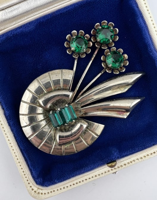 Vintage Sterling Silver Retro Era Large Brooch: Vintage Sterling Silver Retro Era Large Brooch. Hallmarked. Set with emerald paste. Measures just over 2.75 inches in length. Weighs approximately 19 grams total.