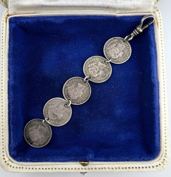 Antique C 1870 to 1900 Canadian Silver Coin Fob: Antique C 1870 to 1900 Canadian Silver Coin Fob w Dog Clip. Watch chain fob or pendant made with five antique Canadian coins dated 1870 to 1900. Measures 4 inches in length.