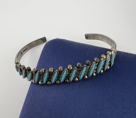 Native American Sterling & Turquoise Bracelet: Native American Sterling & Turquoise Bracelet. Cuff bracelet. Measures approximately 2.25 inches across the interior opening, slightly adjustable.