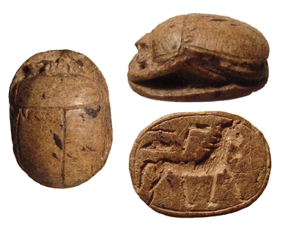 Egyptian brown steatite scarab, New Kingdom: An Egyptian brown steatite scarab, New Kingdom, c. 1570 - 1075 BC, the body and legs nicely carved, the base depicting a horse standing to right. L: 1.4 cm. Ex Massachusetts private collection.