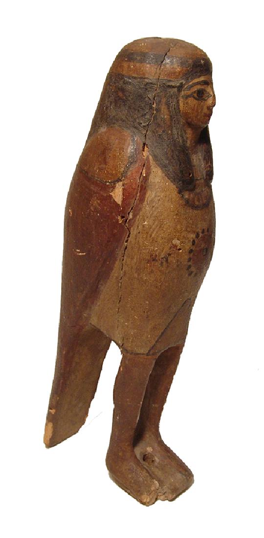Handsome Egyptian wooden Ba bird, Late Period: A handsome Egyptian wooden Ba bird, Late Period, c. 664 - 332 BC, of attractive form with painted gesso over wood, the human head wearing tripartite wig with headband, broad collar around the neck. Th