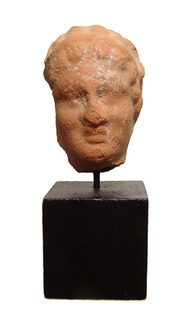 A Greek terracotta female head (1 of 3)