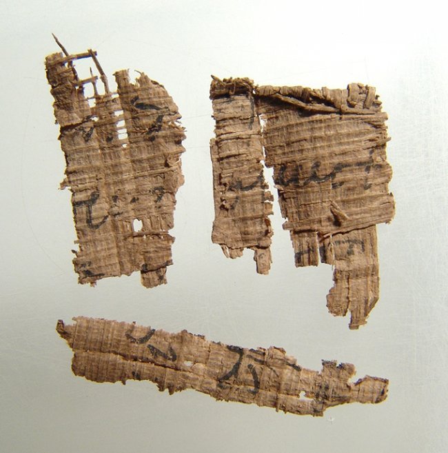 A group of 4 ancient Egyptian papyrus fragments: A group of 4 ancient Egyptian papyrus fragments. Largest 28 x 24mm. Each with light deposits. Ex Tom Cederlind estate, Portland, OR.
