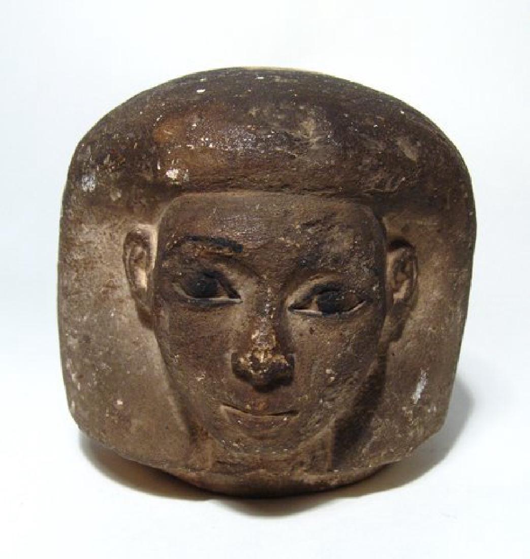 An Egyptian limestone canopic jar head of Imsety (1 of 5)