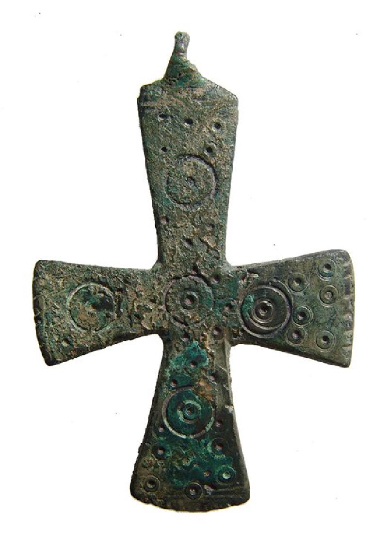 A very nice Byzantine bronze cross: A very nice Byzantine bronze cross, c. 10th - 11th Century AD, with incised circular decoration on either side and looped for suspension. 3 1/8 in x 2 1/8 in (7.9 x 5.4 cm). With COA by Frank Kovacs,
