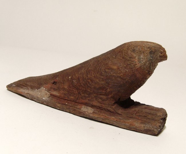 An Egyptian carved wooden figure of a falcon (1 of 4)