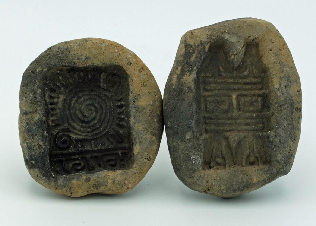 A pair of Teotihuacan adorno molds from Mexico: A pair of Teotihuacan adorno molds from Mexico, ca. 300 – 700 AD. These were used in the manufacture of complex incensarios. The first creates a 2 in long serpentine spiral adorno, a design that als