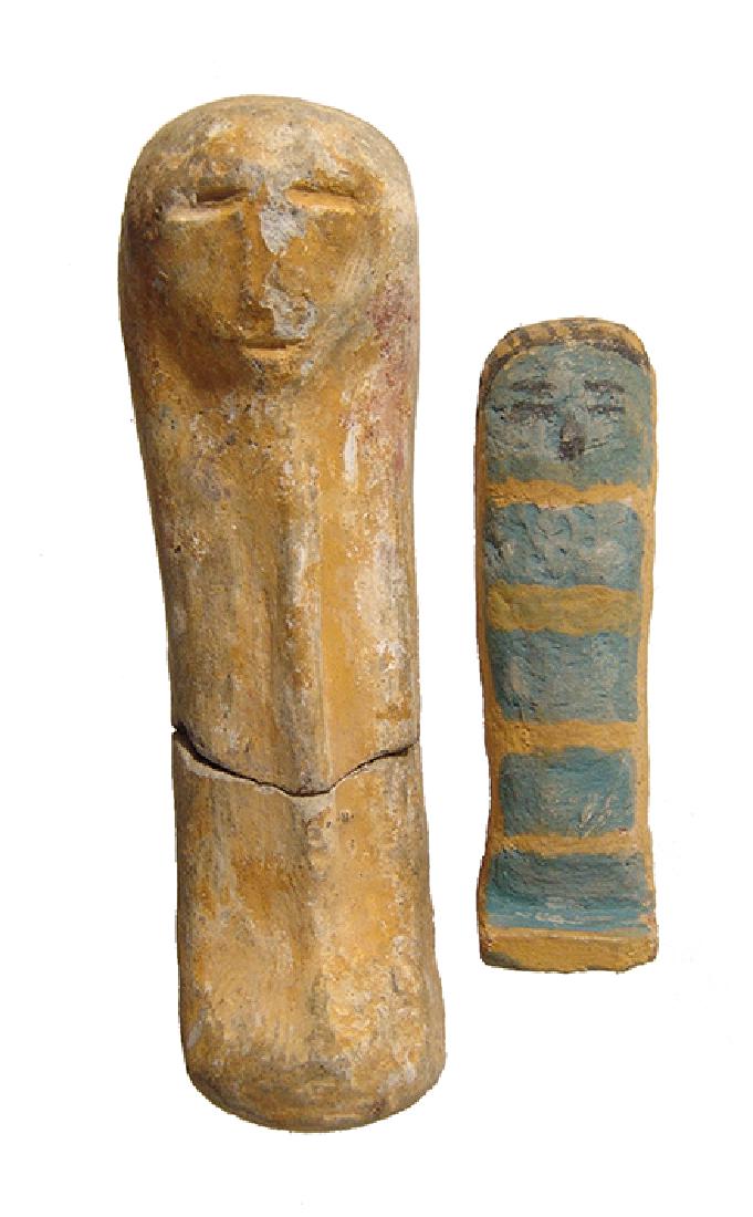 A pair of Egyptian highly stylized ushabtis, Late: A pair of Egyptian highly stylized ushabtis, Late Period, c. 664 - 30 BC, the first wood gessoed then painted with light blue and yellow alternating bands, facial details indicated in black. H: 2 3/8 