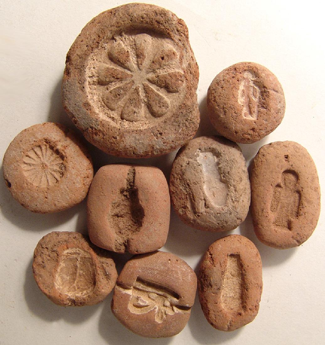 A set of 9 Egyptian terracotta molds, New Kingdom (1 of 2)