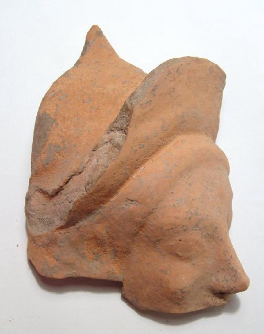 Greek terracotta head fragment of a goddess (1 of 3)