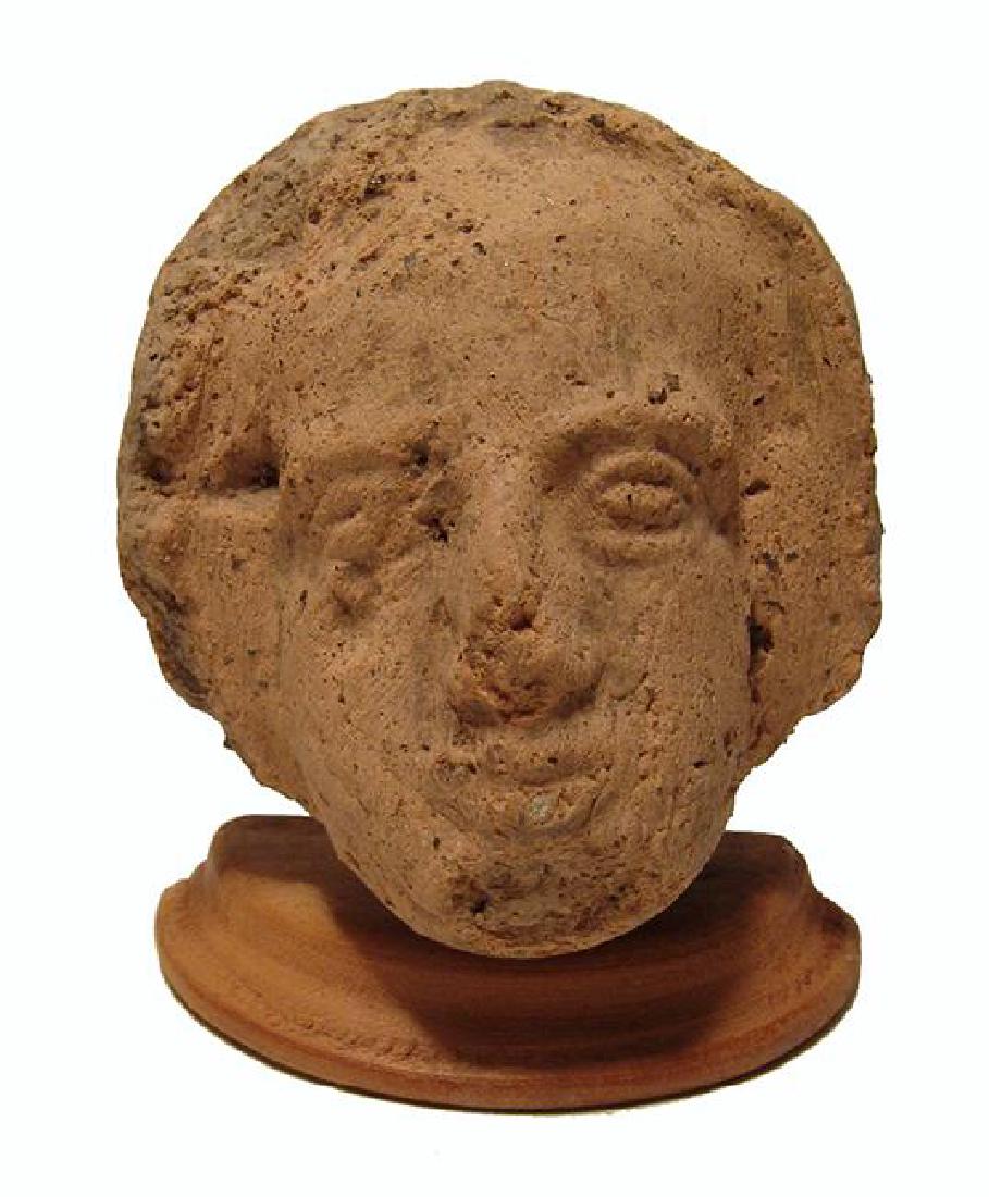 An Etruscan terracotta head of a veiled woman (1 of 3)