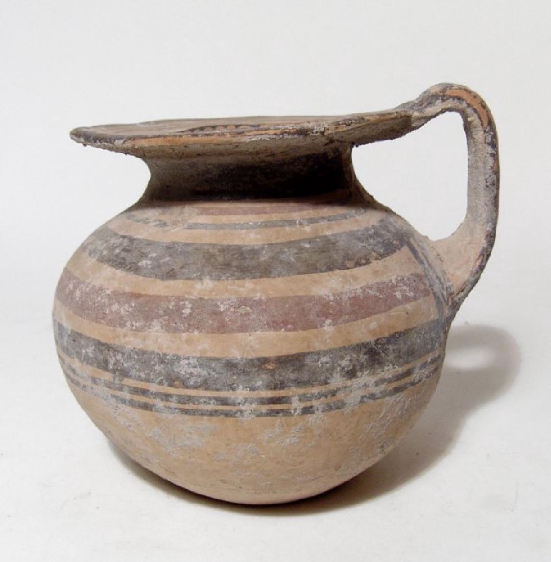 A nice Daunian polychrome olpe, Italic (1 of 4)