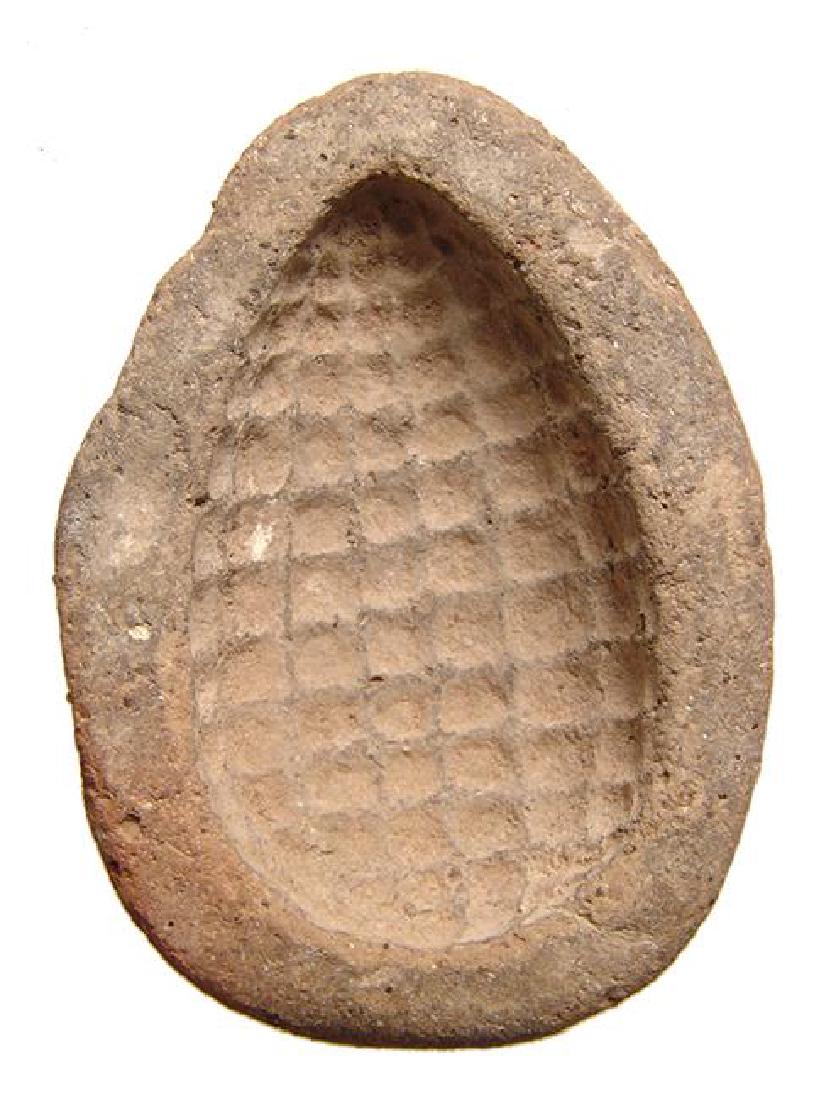 A large Egyptian terracotta mold for a bunch of grapes (1 of 3)
