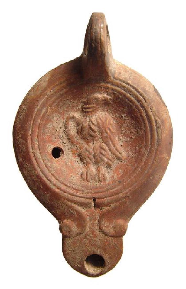 A nice Roman discus lamp depicting an eagle (1 of 3)
