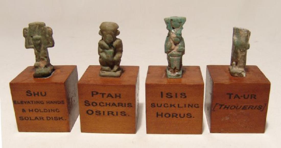 Collection of 4 small Egyptian faience amulets, Late: A collection of 4 small Egyptian faience amulets, Late Period, c. 664 - 30 BC, all mounted on small antique wood bases with their name in black ink. Deities represented are Isis, Shu, Pataikos and Taw