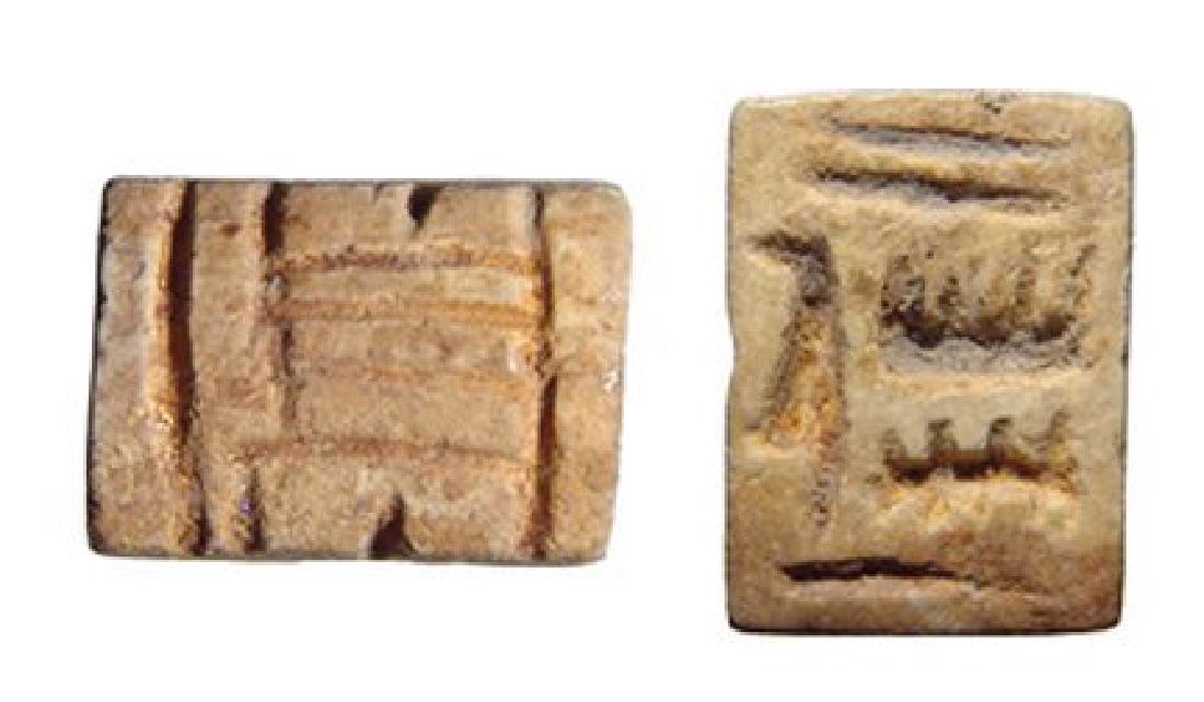 An Egyptian steatite plaque, New Kingdom: An Egyptian steatite plaque, New Kingdom, c. 1570 - 1075 BC, with styled 'Amen-re' on back and 'Amen-re' on base as well, readable from up or down. 13 x 9 mm. No remaining glaze. Ex Royal Athena Galle
