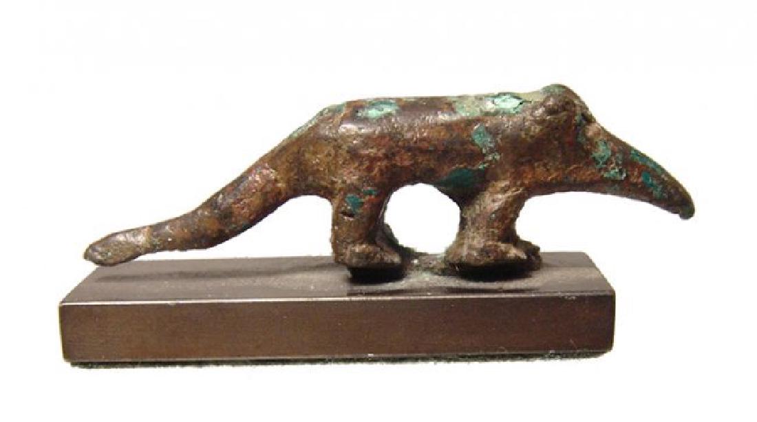 A nice Egyptian bronze figurine of a shrew, Late Period: A nice Egyptian bronze figurine of a shrew, Late Period, c. 664 - 332 BC, naturalistically modeled and originally sat atop a shrew sarcophagus box. L: 2 1/2 in (7.3cm), H: 3/4 in (1.9cm). Attractively