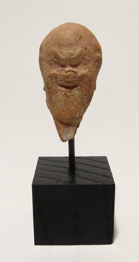 A nice terracotta head wearing and actor's mask (1 of 3)