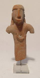 A Cypriot terracotta figure of a young man: A Cypriot terracotta figure of a young man, Cypro-Geometric II-III, c. 950 - 750 BC, wearing headdress with long hair, his nose quite prominent. H: 5 in (12.8cm). Light deposits, lucite base. Ex