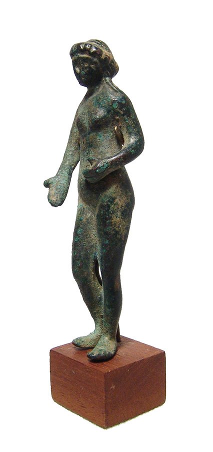 A nice Roman bronze figurine of Venus: A nice Roman bronze figurine of Venus, 1st - 3rd Century AD, depicted standing nude, her hair in curled locks descending onto her shoulders, left hand on her belly, right hand open at her side. H: 4 i