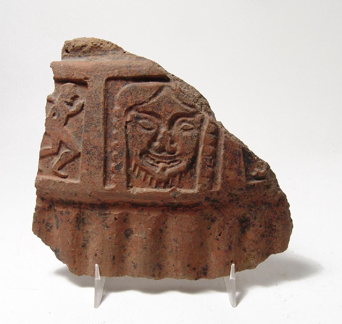 Etruscan redware vessel fragment depicting a Gorgon (1 of 2)