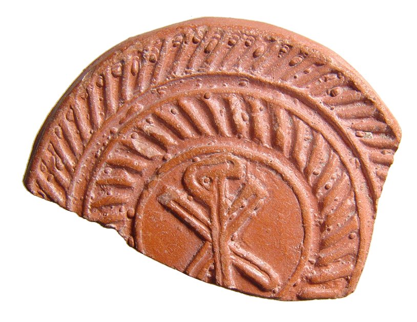 A Roman red-ware sherd with a Chi-Rho: A Roman red-ware sherd with a Chi-Rho, North Africa, c. 4th - 5th Century AD, with good style and detail. 1 7/8 x 2 in (4.8 x 5.1 cm). Light deposits. Ex Northern California private collection.