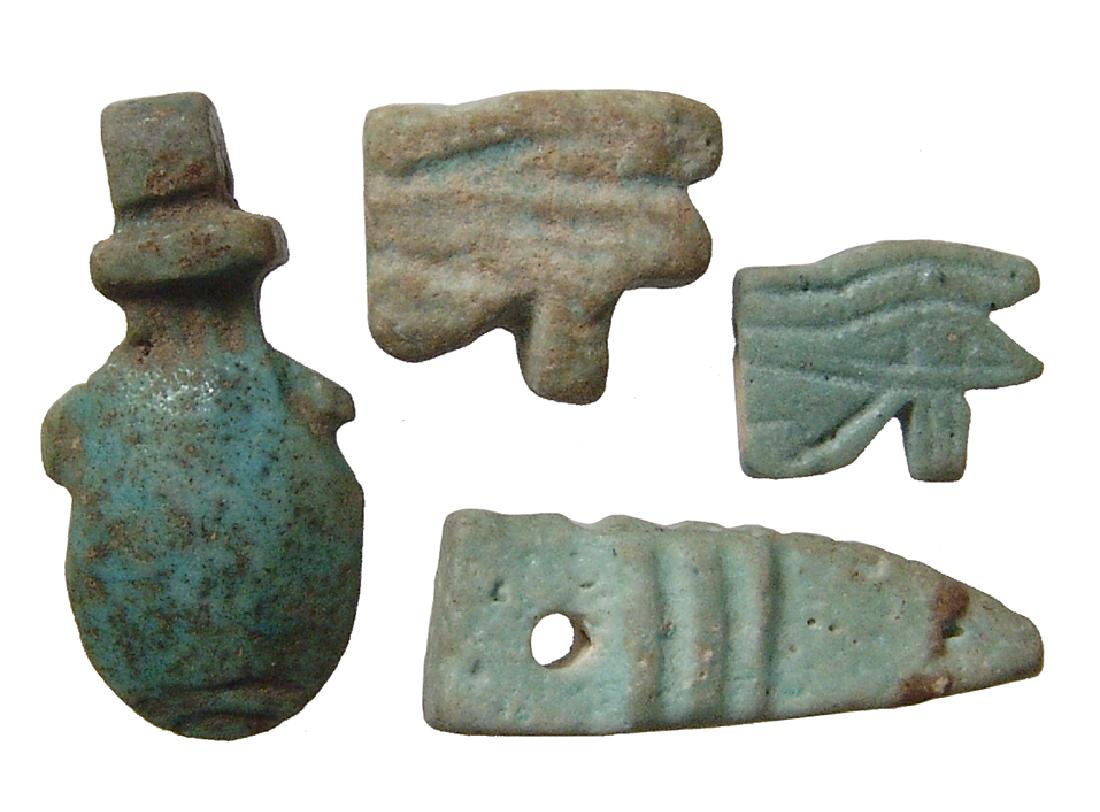 A group of 4 Egyptian faience amulets, Late Period (1 of 2)