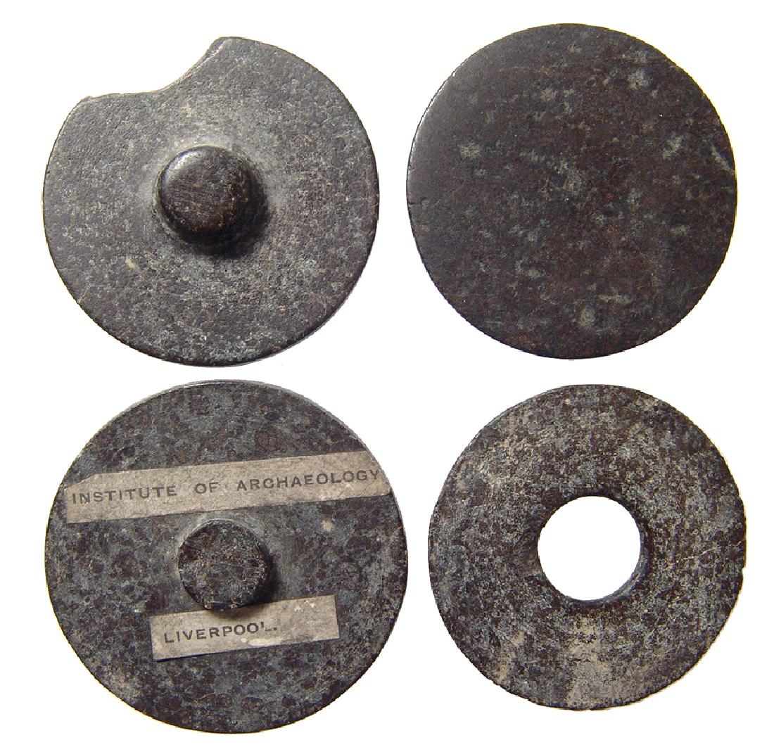 A collection of 4 Egyptian stone cosmetic vessel lids (1 of 2)