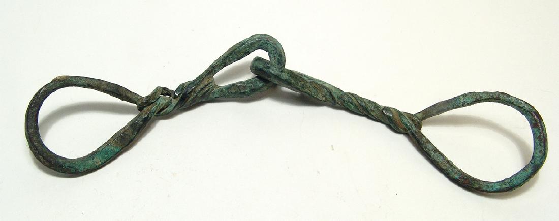 A Near Eastern bronze snaffle bit for a horse (1 of 2)
