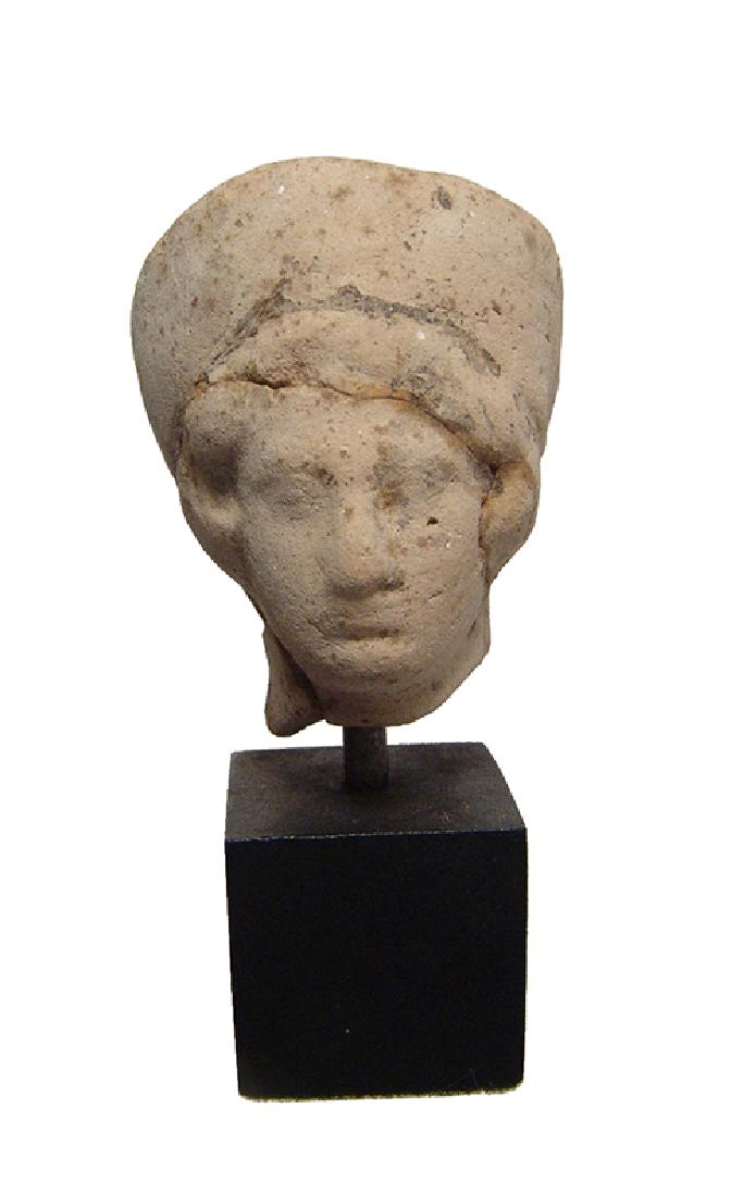 A Greek terracotta head of a woman (1 of 4)