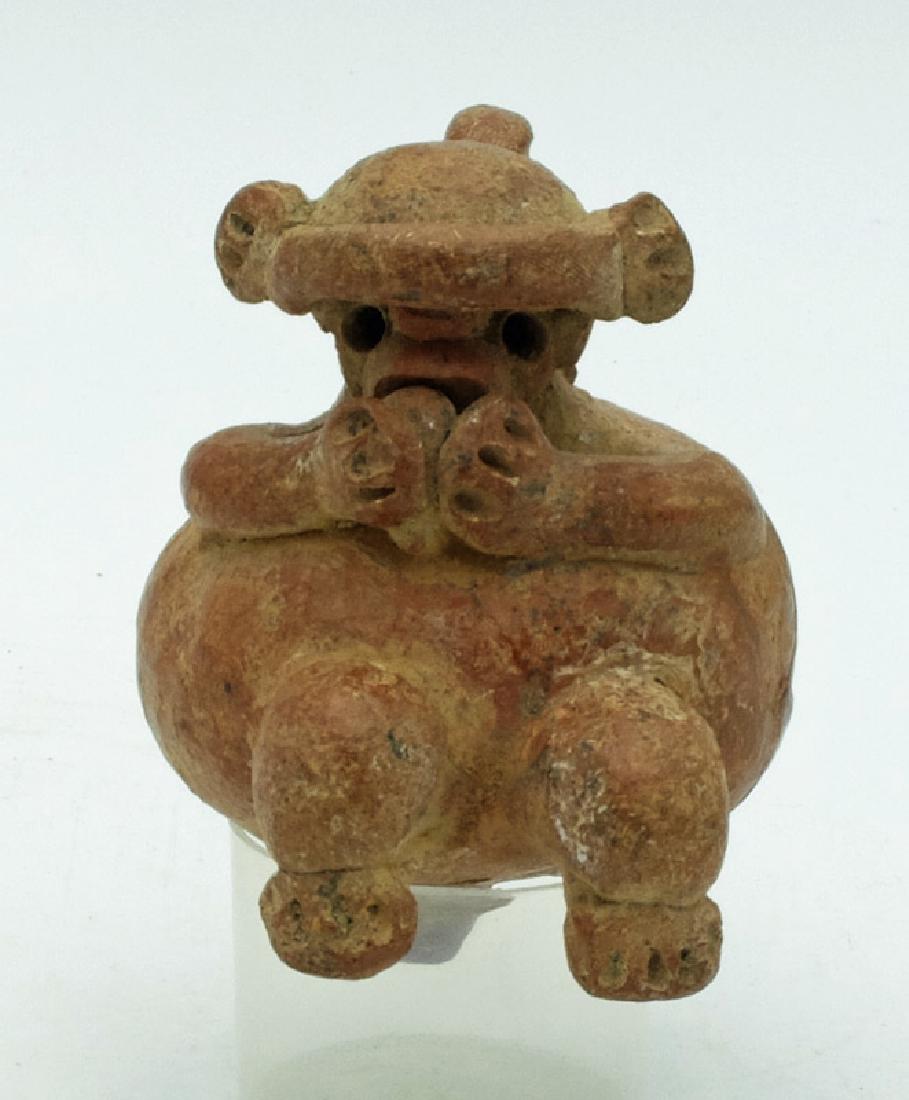 An adorable El Bosque figure from Costa Rica: An adorable El Bosque figure from Costa Rica, c. 100 BC - AD 500, this cute Santa Clara example depicts a shamanistic monkey deity eating food held with both hands. He wears a nice headdress and has t
