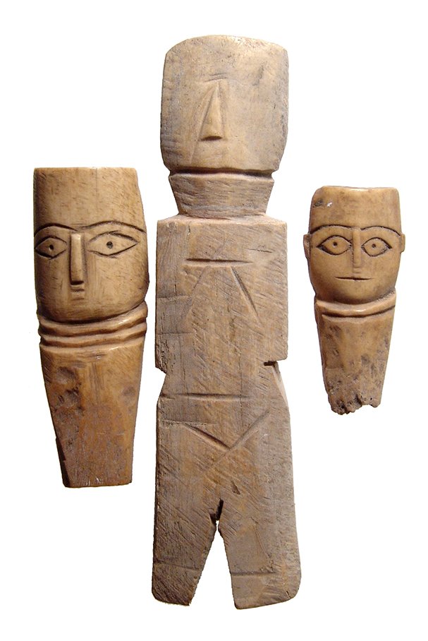 A lot of 3 Coptic bone dolls, Roman/Byzantine Egypt: A lot of 3 Coptic bone dolls, Roman/Byzantine Egypt, c. 5th – 7th Century AD, the larger nicely carved with body and legs, the other two head with well-carved face and tapered bases to fit into a bo