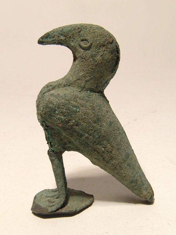 Byzantine/ Islamic bronze plated bird, Holy Land: A Byzantine/ Islamic bronze plated bird from the Holy Land, c. 6th - 10th Century AD, with detailed eyes and integral base, breaks in the bronze sheet outer plating reveal and iron core. H: 3 1/8 in (