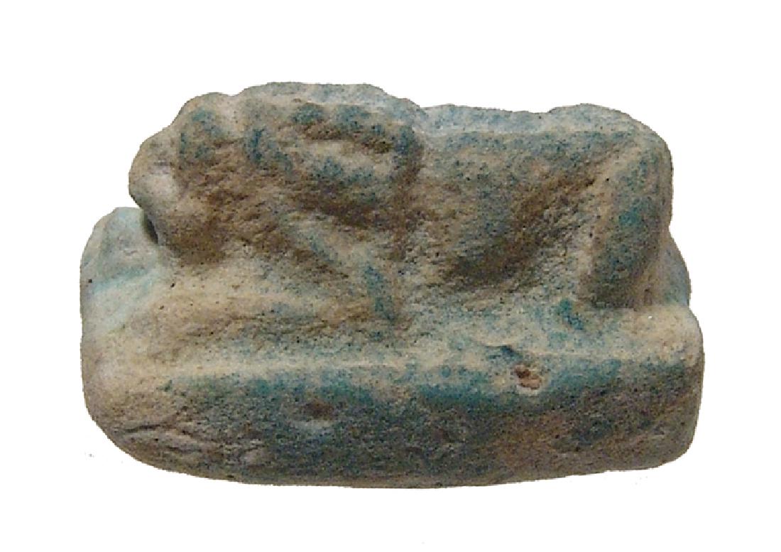 Egyptian faience recumbent lion amulet, Ptolemaic (1 of 2)